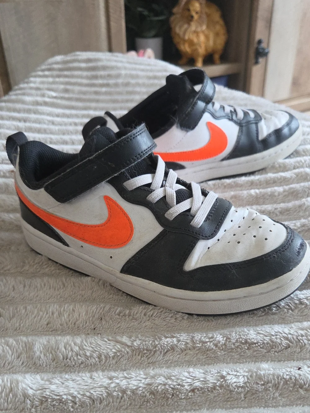 Nike Kids Low-Top Sneakers in White, Black & Orange Swoosh